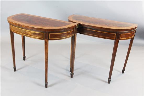 A pair of George III style satinwood banded mahogany D shaped card tables, W.3ft 11.5in. D.1ft 5in. H.2ft 5in.